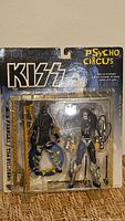 Front of sealed Kiss Psycho Circus figure set showing both figures and accessories