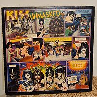 Front cover of Kiss Unmasked LP showing comic artwork