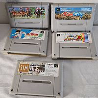 Front view of five Super Famicom cartridges showing labels
