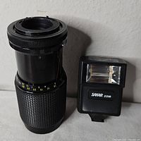 Lens and flash side by side showing overall condition and scale