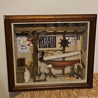 Full view of shadow box showing frame and interior nautical scene