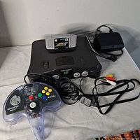 Console, cartridge, power adapter, A/V cable and controller overview