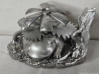 Front view of silver Venusaur bookend showing figure detail and base