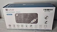 Front of box showing Royliver Heating Pad, product image, brand and model