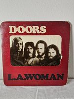 Front of die-cut jacket with band photo