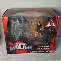 Front view of sealed Tomb Raider Lara Croft vs S.I.M.O.N action figure set in box