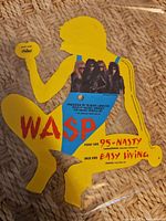 Full view of shaped picture disc vinyl showing silhouette shape, logo and titles