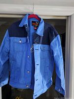 Full view of front showing two-tone design and button closure