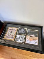 Full view of framed collage showing arrangement of four prints