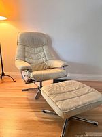 Full view of swivel recliner chair and ottoman