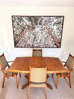 Full view of oak dining table with four chairs