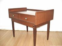 Three-quarter view of wood end table showing full structure and legs