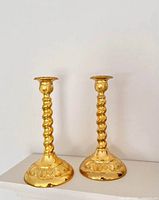 Front view of both brass candlestick holders