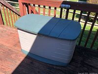 Closed Rubbermaid deck storage box on deck