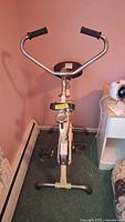 Front view of DP DXC 5000 exercise bike showing handlebars, seat, frame and pedals