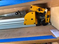 Yellow mounting bracket and part of aluminum rail