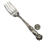 Full view of Alvin Bridal Rose sterling fork beside coin for scale
