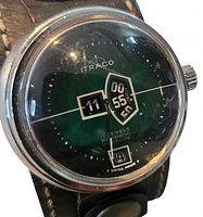 Oblique view of watch face showing brand, jump-hour discs and case