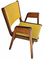 Three-quarter view of wooden frame chair with mustard upholstery