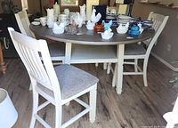 Overall view of table with chairs around showing finish and style