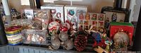Overview of all boxed sets, loose ornaments, pinecones, tins on shelf