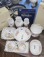 Group shot showing all 10 bone china pieces and boxes