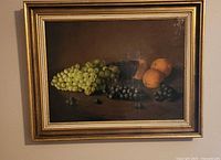 Framed still life painting on wall