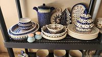 Front view of entire stoneware collection on shelf