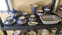 Shelf view showing entire collection of Polish pottery pieces