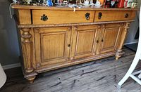 Front view showing drawers, cabinet doors, hardware and finish