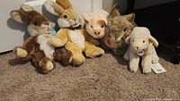 Group shot of all five Steiff plush animals