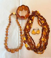 Group shot of all four amber jewelry pieces