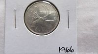 Reverse of 1966 Canadian quarter in holder