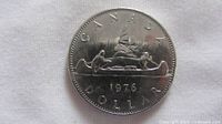 Reverse side showing CANADA, voyageur canoe design, 1976 date