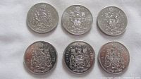 Six 1979 Canadian 50 cent coins reverse side