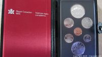 Case exterior and obverse view of coins