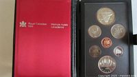 Proof set in red RCM case, obverse sides visible