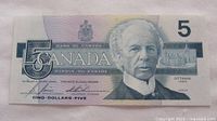 Obverse of 1986 Canadian $5 note showing Sir Wilfrid Laurier and large numeral 5
