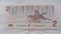 Reverse side showing American robins and CANADA text