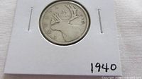 Reverse of 1940 Canadian quarter in holder