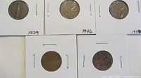 Obverse sides of five Canadian pennies in flips; years handwritten