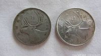 Both quarters reverse side showing caribou and denomination