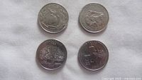 Obverse/reverse view of four state quarters