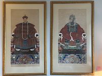 Both framed portraits side by side