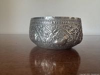 Side view of Thai silver bowl showing embossed details