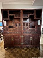 Front view of both rosewood cabinets showing overall design and carving