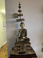 Full view of statue and umbrella showing overall design and scale