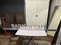 BARISTA CAFÉ sign on table