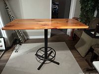 Full view of bar-height table with cast-iron base
