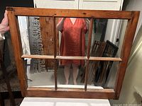 Front view of antique wooden window frame fitted with six mirrors